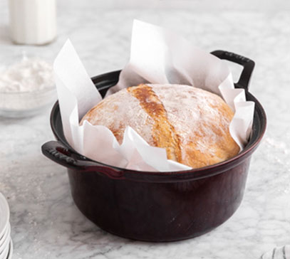 A baked loaf of bread in a pan