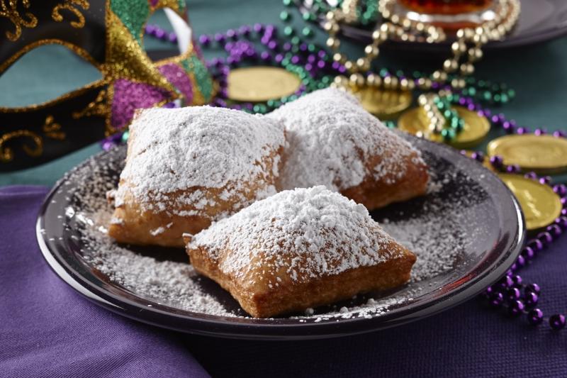 Beignets are a traditional New Orleans-style donut recipe topped with powdered sugar